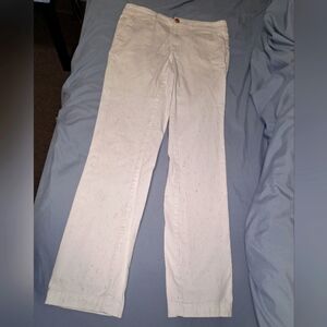 A pair of CHNO white confetti colored pants in a ladies 27 waist and 29" inseam